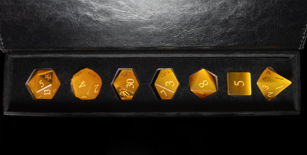 yellow cat's eye glass and gemstone polyhedral DnD RPG dice set