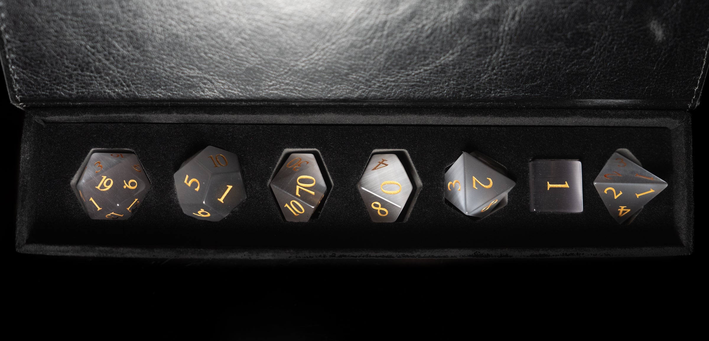 grey cat's eye glass and gemstone polyhedral DnD RPG dice set