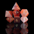 strawberry cat's eye glass and gemstone polyhedral DnD RPG dice set