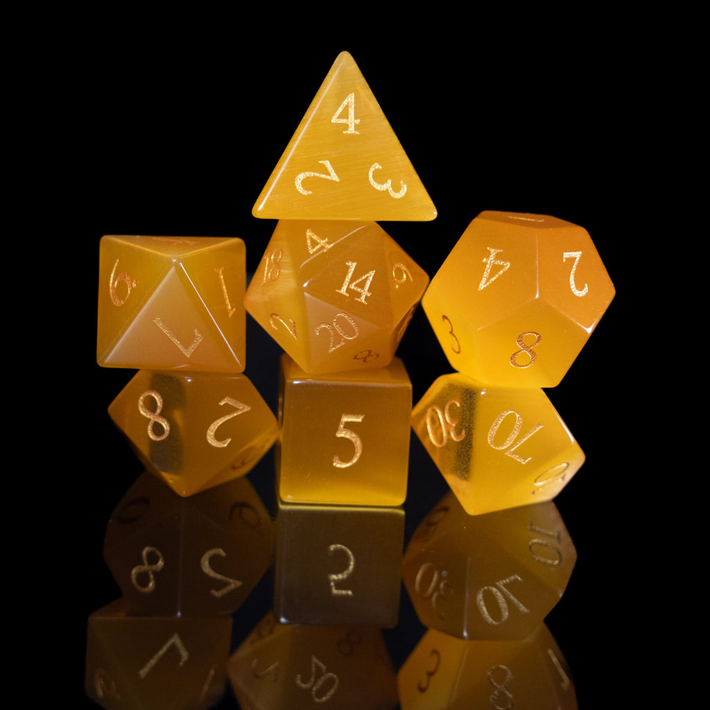 yellow cat's eye glass and gemstone polyhedral DnD RPG dice set