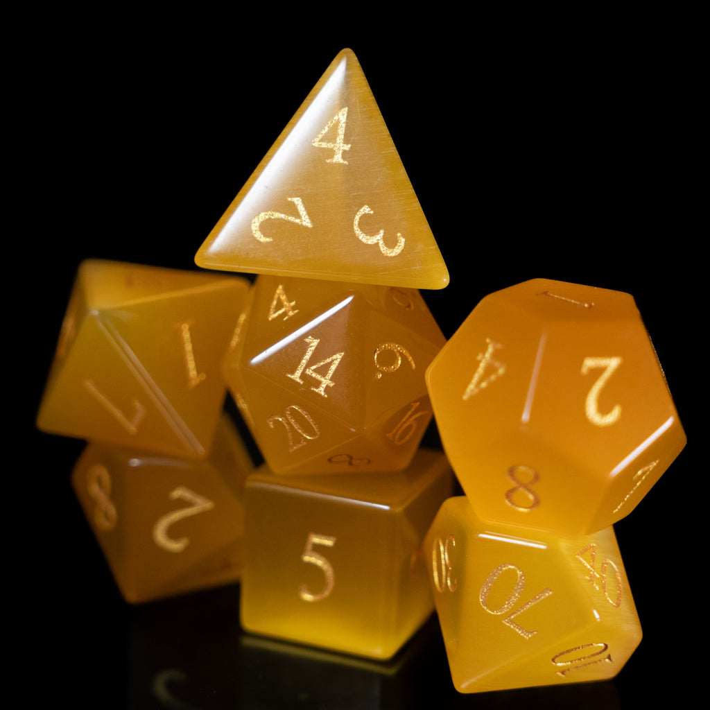 yellow cat's eye glass and gemstone polyhedral DnD RPG dice set