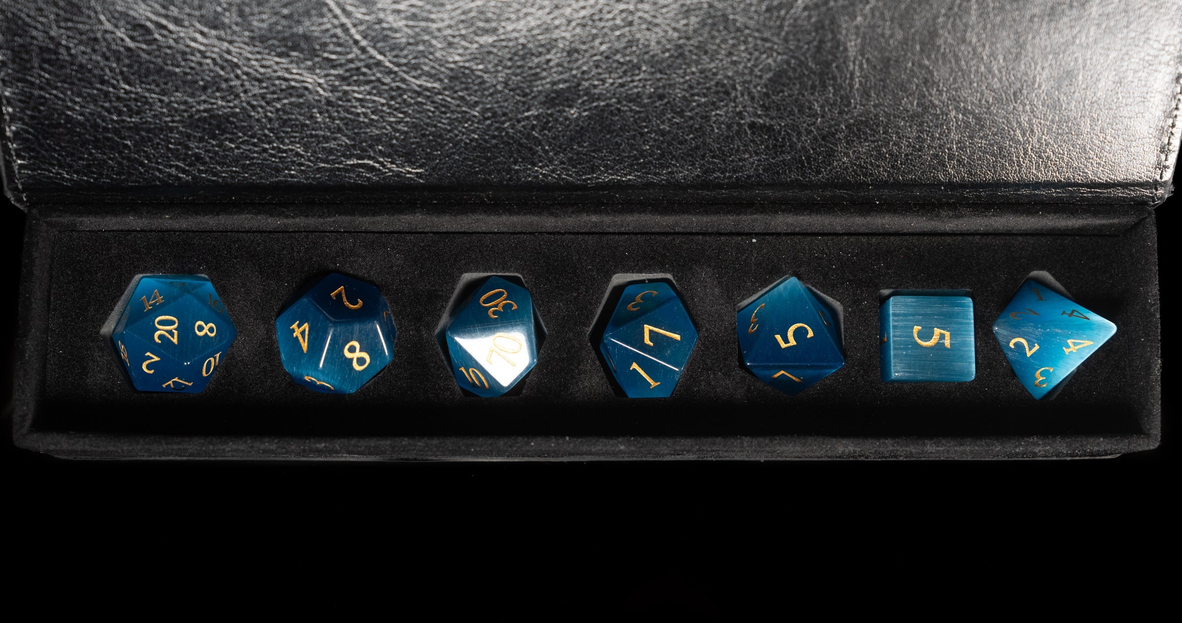 sky blue cat's eye glass and gemstone polyhedral DnD RPG dice set